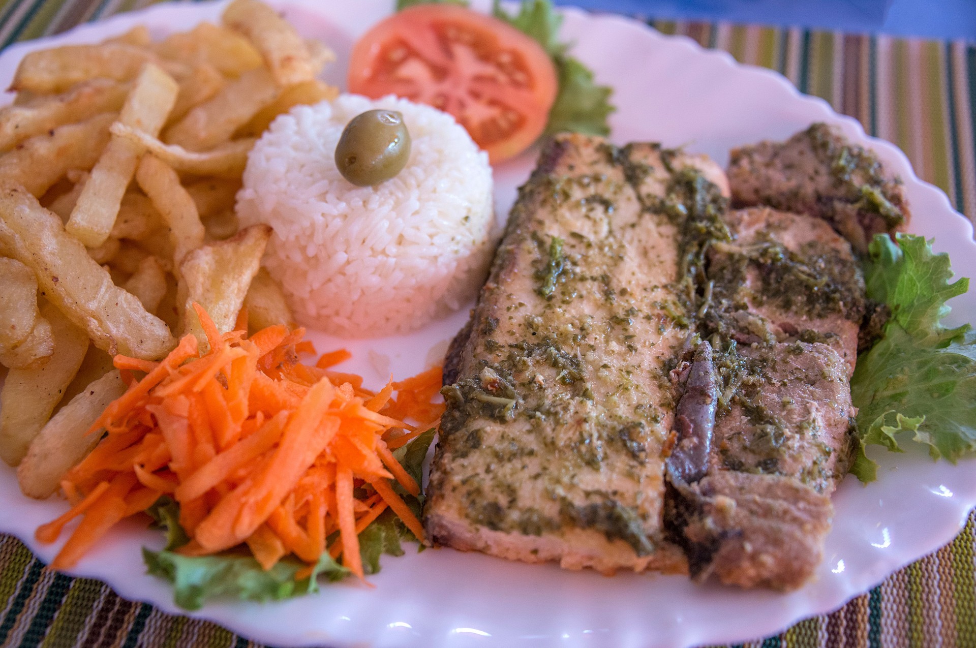 Fish with rice, salad and chips